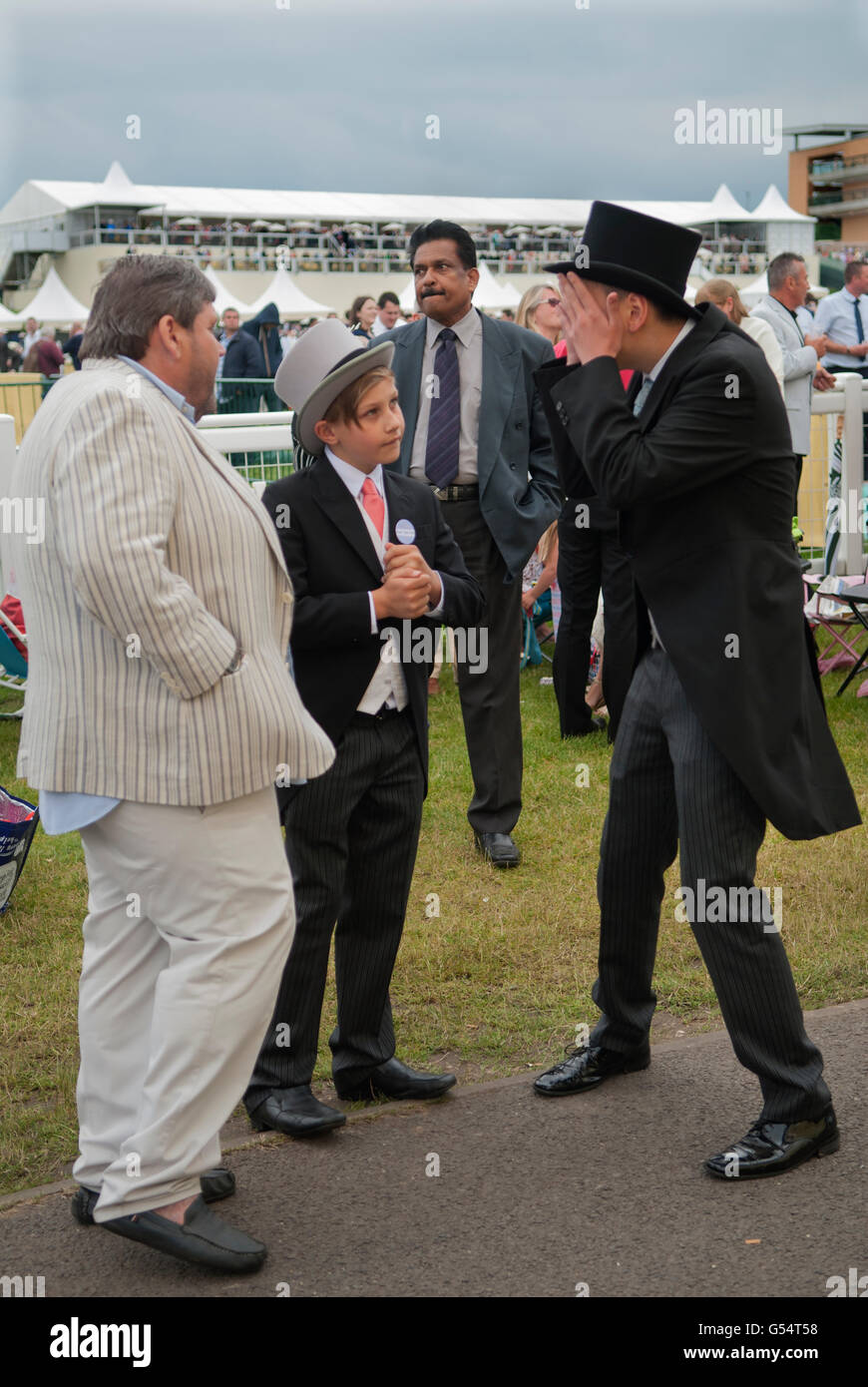 Horse racing, teen boys wearing top hats and tail coats on The Heath