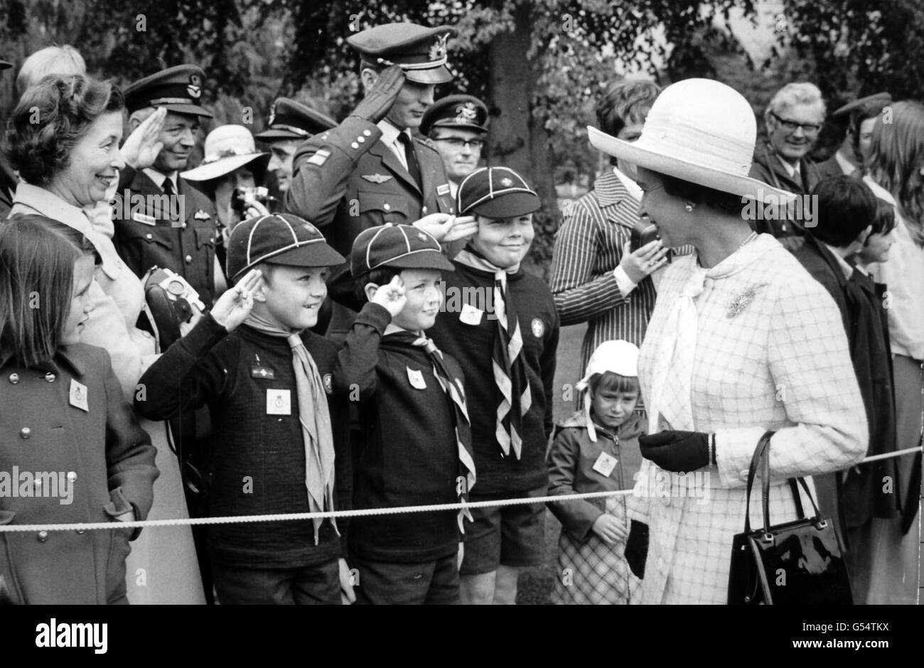 Salutes for Queen Elizabeth II from bystanders at the RAF Staff