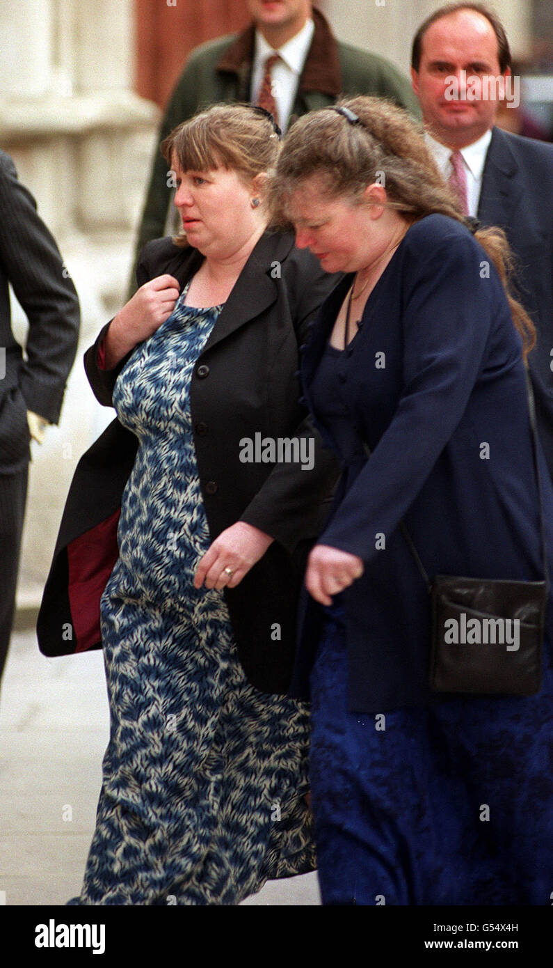 Deborah Martin, centre, arriving at the High Court, London, on the second day of a case against Norfolk and Norwich Healthcare Trust. Mrs Martin and her husband Steven are taking legal action against the trust. * over alleged complications during their daughter Katy's birth which they claim caused her to develop cerebral palsy. Stock Photo