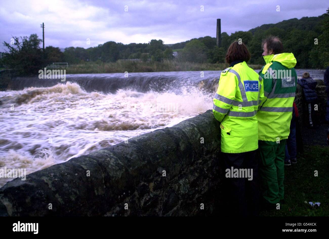 Members of the emergency services look at the weir of the River Ribble, which is downstream from Stainforth Beck, near Settle, North Yorkshire, where two school girls where swept away earlier in the day. 08/03/02 : An inquest jury at Harrogate Magistrates Court decided the deaths of two teenage girls, Rochelle Cauvet, 14, and 13-year-old Hannah Black, were an accident, Friday 8 March, 2002, recording a verdict of accidental death. They heard how the two girls were washed away while taking part in a river walk in Stainforth Beck, near Settle, North Yorkshire on October 10, 2000. Stock Photo