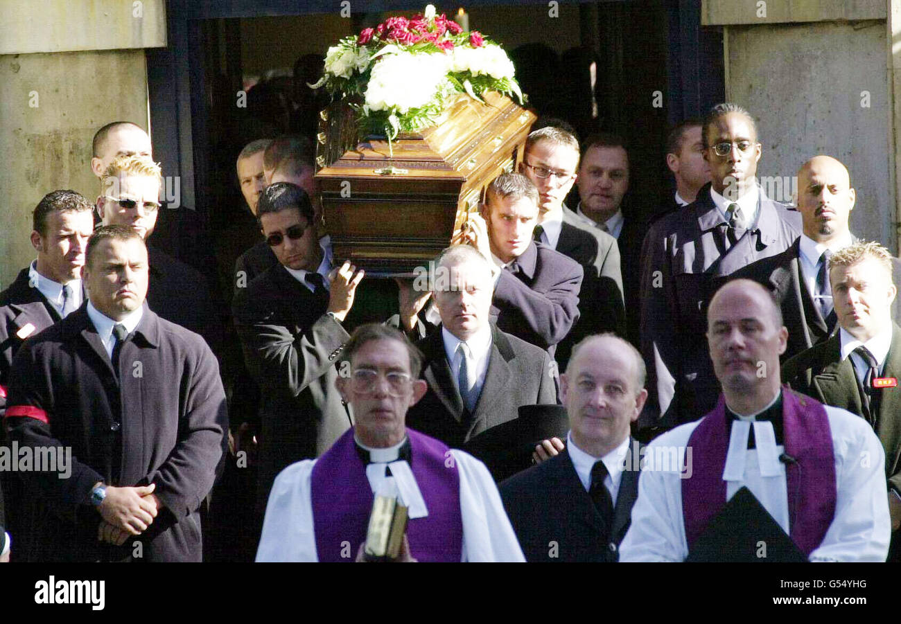 The coffin leaves St Matthew's Church, Bethnal Green, London at Reggie Kray's funeral. The gangland killer died a month after being freed from a life prison sentence on compassionate grounds and 10 days after leaving the Norfolk & Norwich hospital. *... After a service at St Matthew's Church, Tower Hamlets, he will be buried in the family plot at Chingford Mount Cemetery alongside his brother Ronnie and Charlie. The Krays' gang, The Firm, had a Mafia-style grip on London's East End in the 1960s. Stock Photo