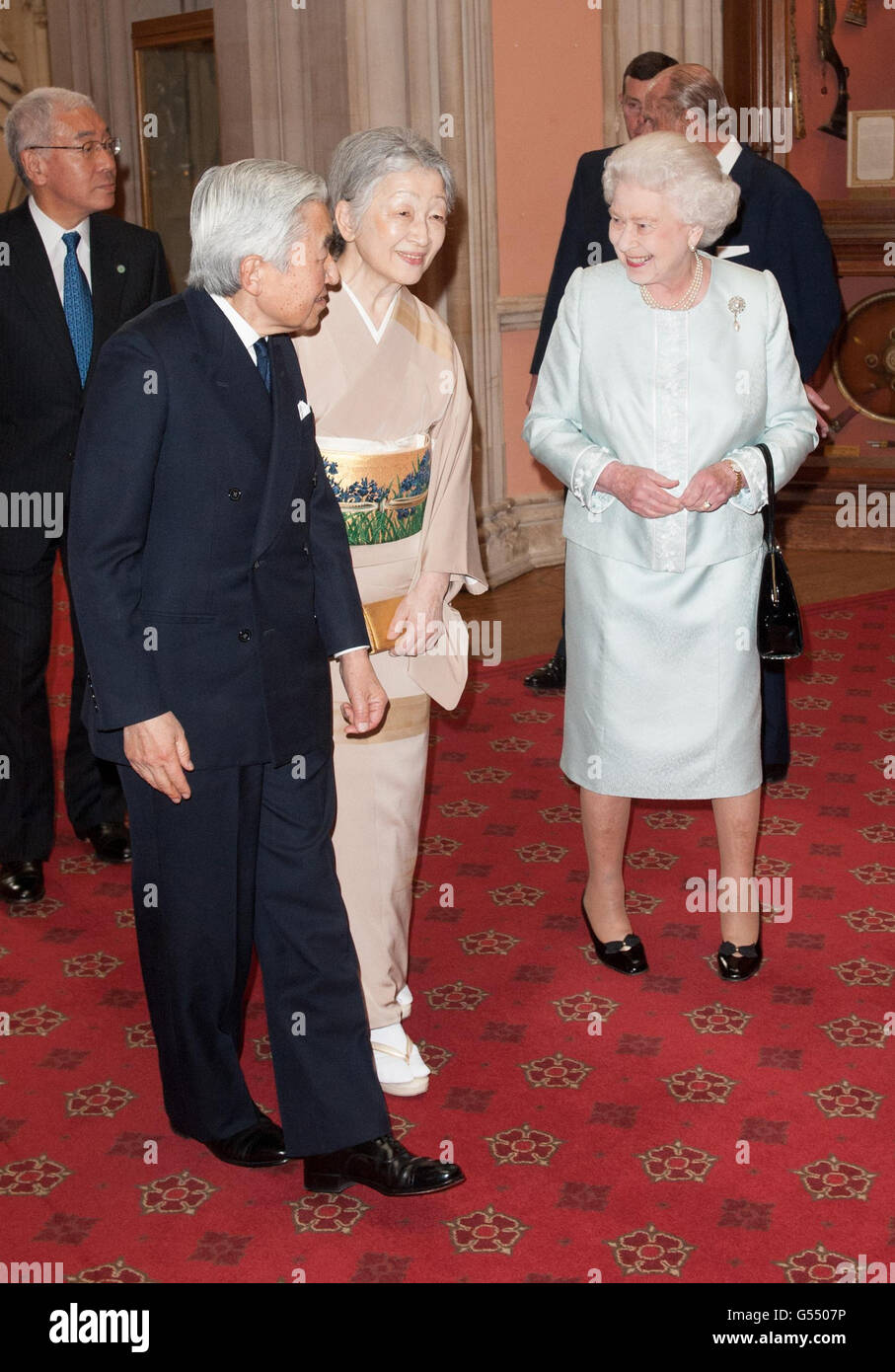 Emperor Akihito and Empress Michiko of Japan are greeted by Queen
