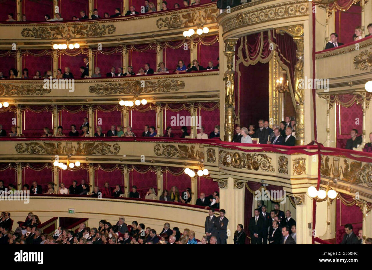 Queen Elizabeth II, in a pale blue dress, and Prince Philip, to her left, in the box at La Scala Opera House, Milan, to see a performance of In The South by Edward Elgar. Riccardo Muti will conduct with the La Scala Philharmonic Orchestra. *... on the penultimate day of the state visit to Italy. Stock Photo