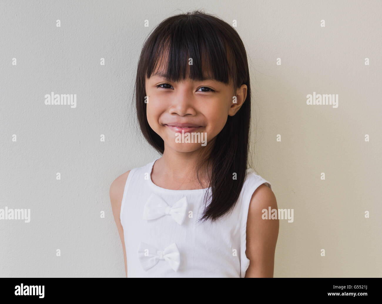 Happy little asian girl isolated in white Stock Photo - Alamy