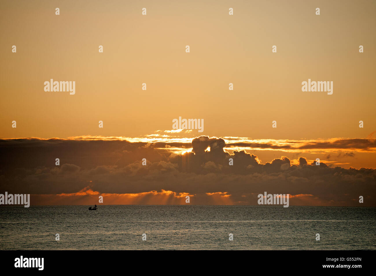 beautiful shapes in the clouds at sunrise over the sea Stock Photo - Alamy