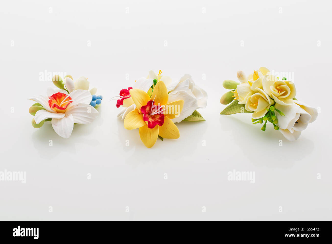 Lovely bouquet of artificial white tulips wrapped in ribbon in pastel  background. Mother's Day concept with copy space Stock Photo - Alamy