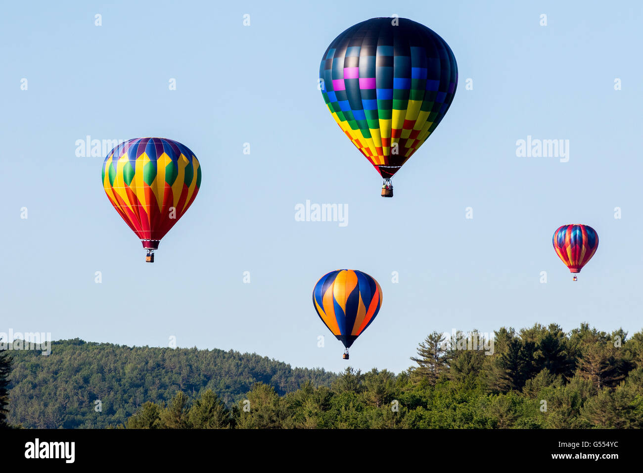 Hot air balloon during Quechee hot air balloons festival with people in basket Stock Photo Alamy