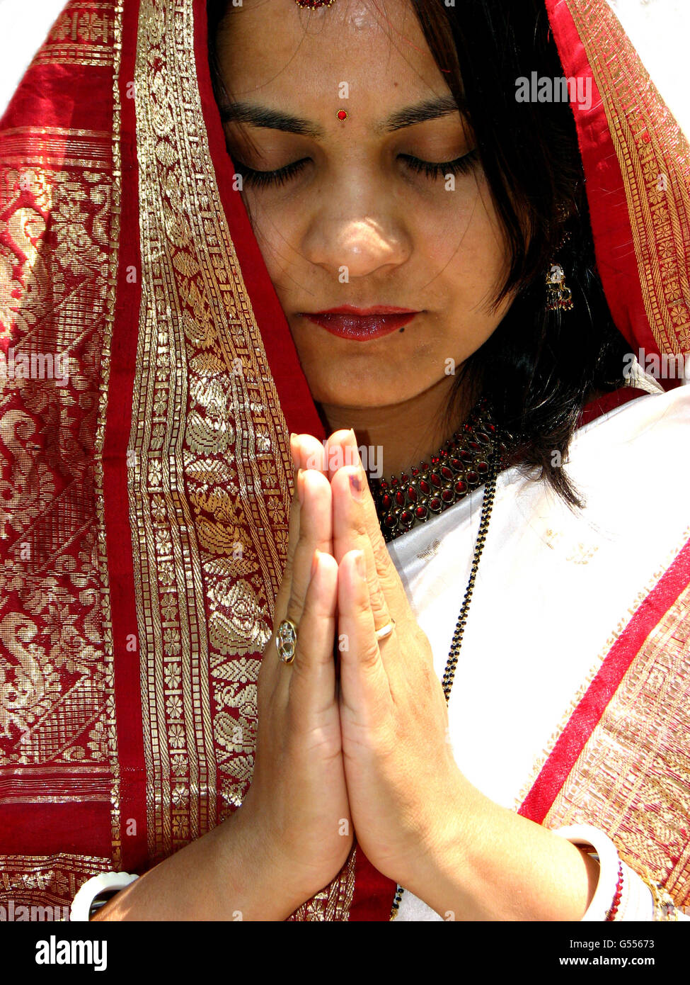 Traditional Indian Woman Praying Stock Photo