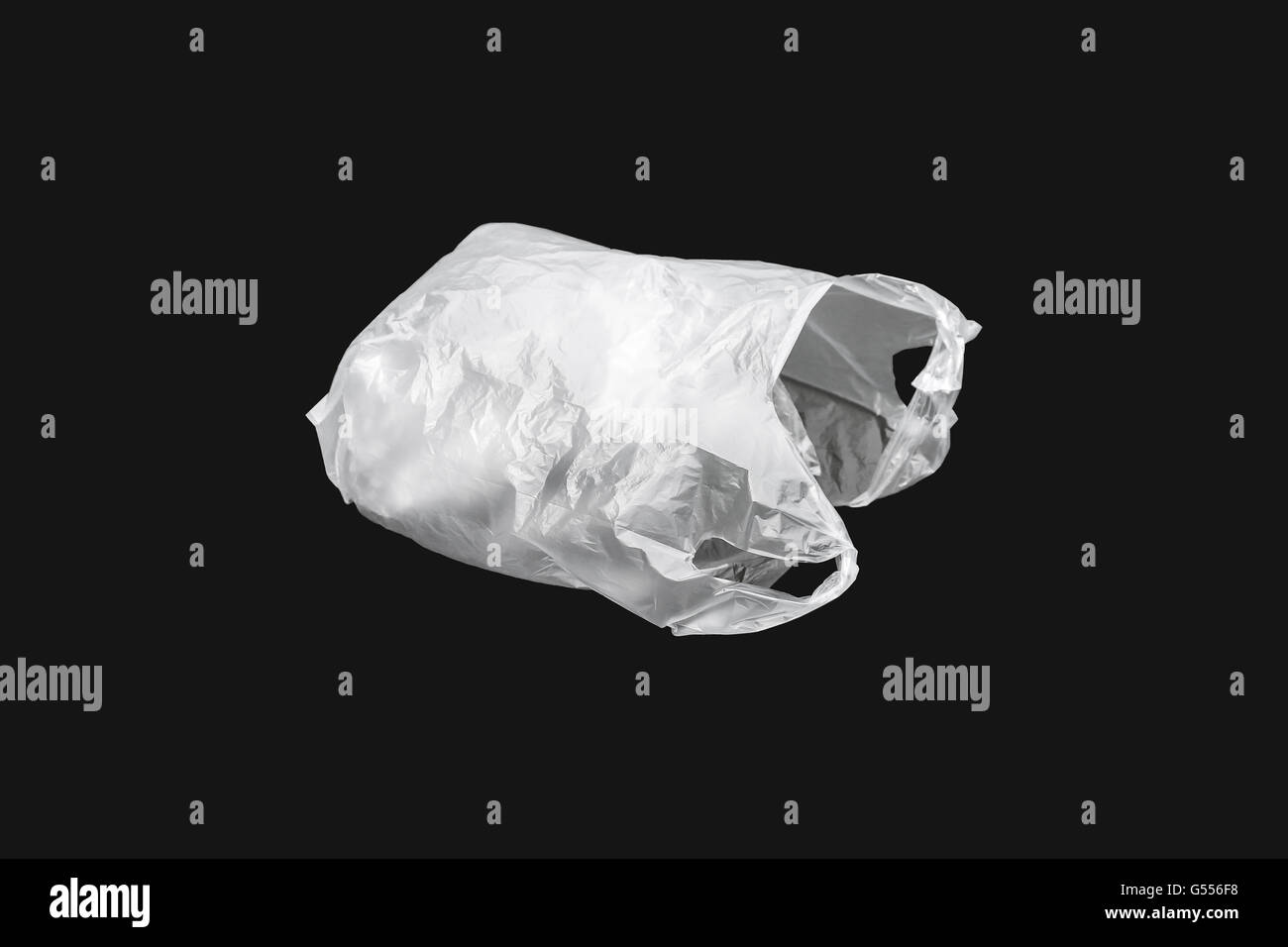 White inflated plastic bag isolated on black background Stock Photo
