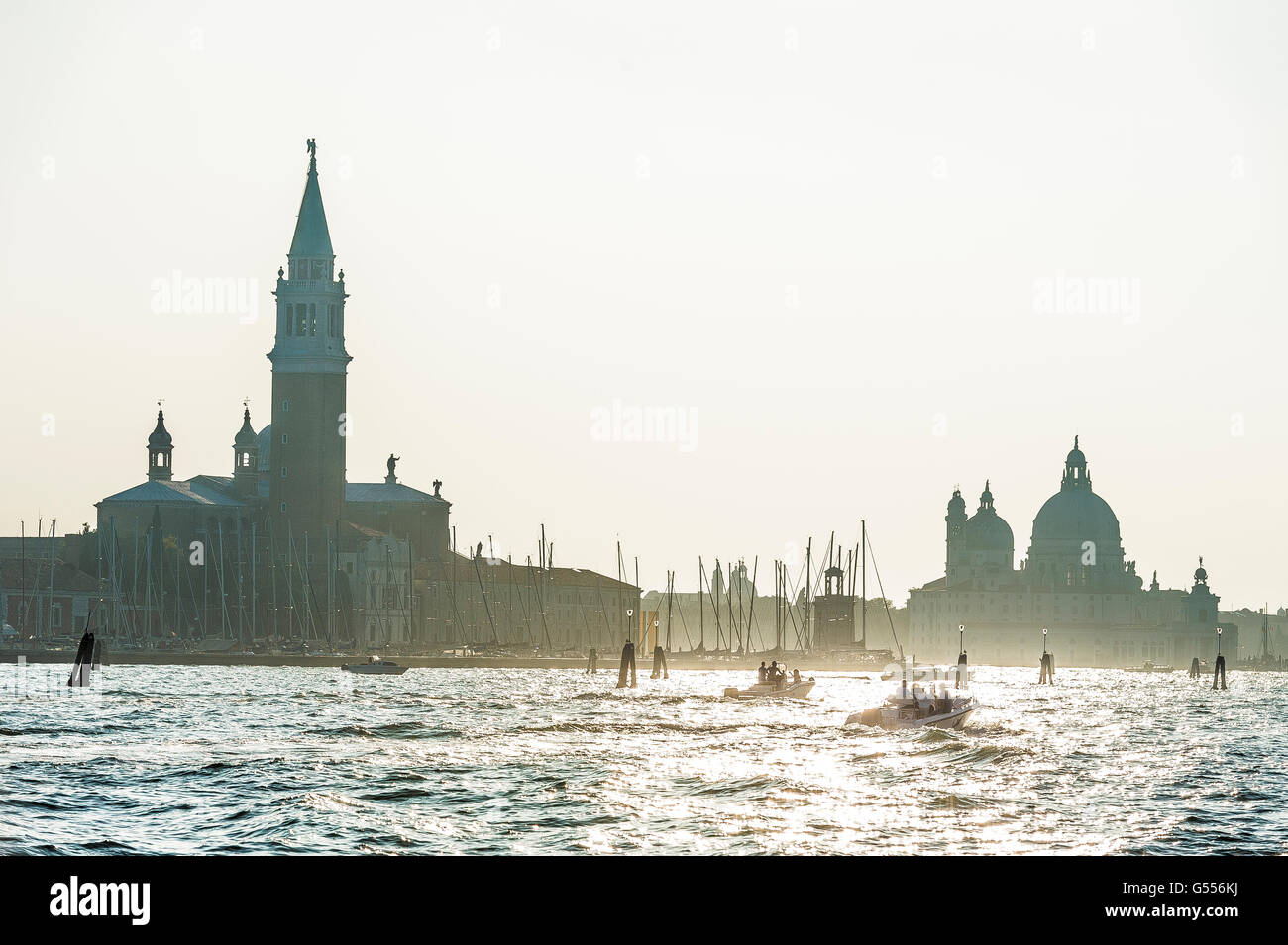 Vaporetto and ferries on the Grand Canal with Basilica Benedictine in the background Venice Stock Photo