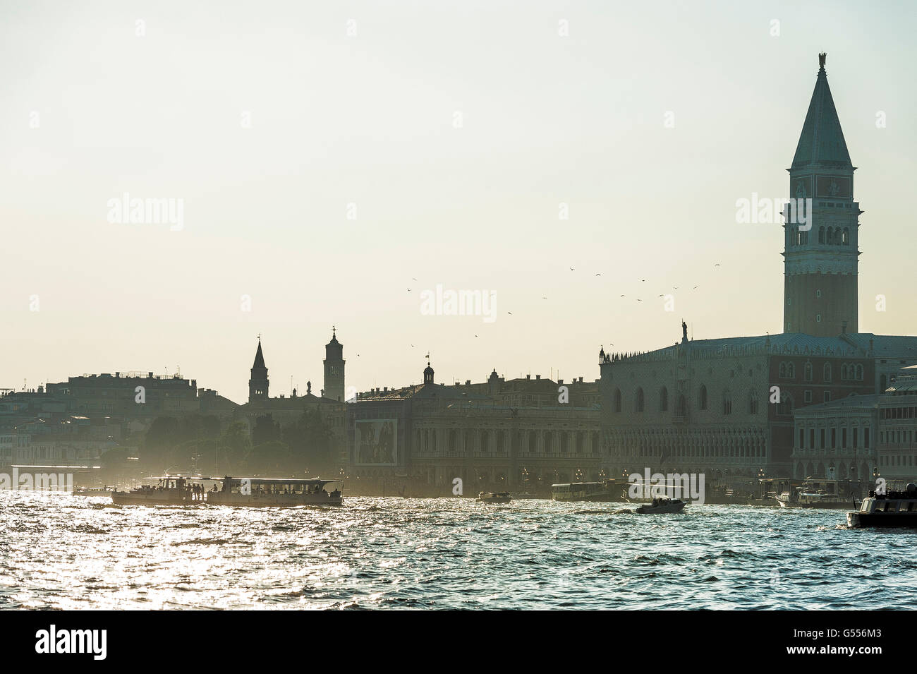 vaporetto ferry on the grand canal with Doge's Palace right hand side of the frame  Venice Stock Photo