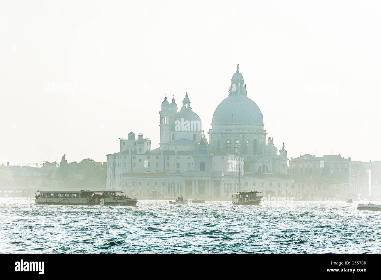 vaporetto ferry on the grand canal with Santa Maria della Salute in the background Venice Stock Photo
