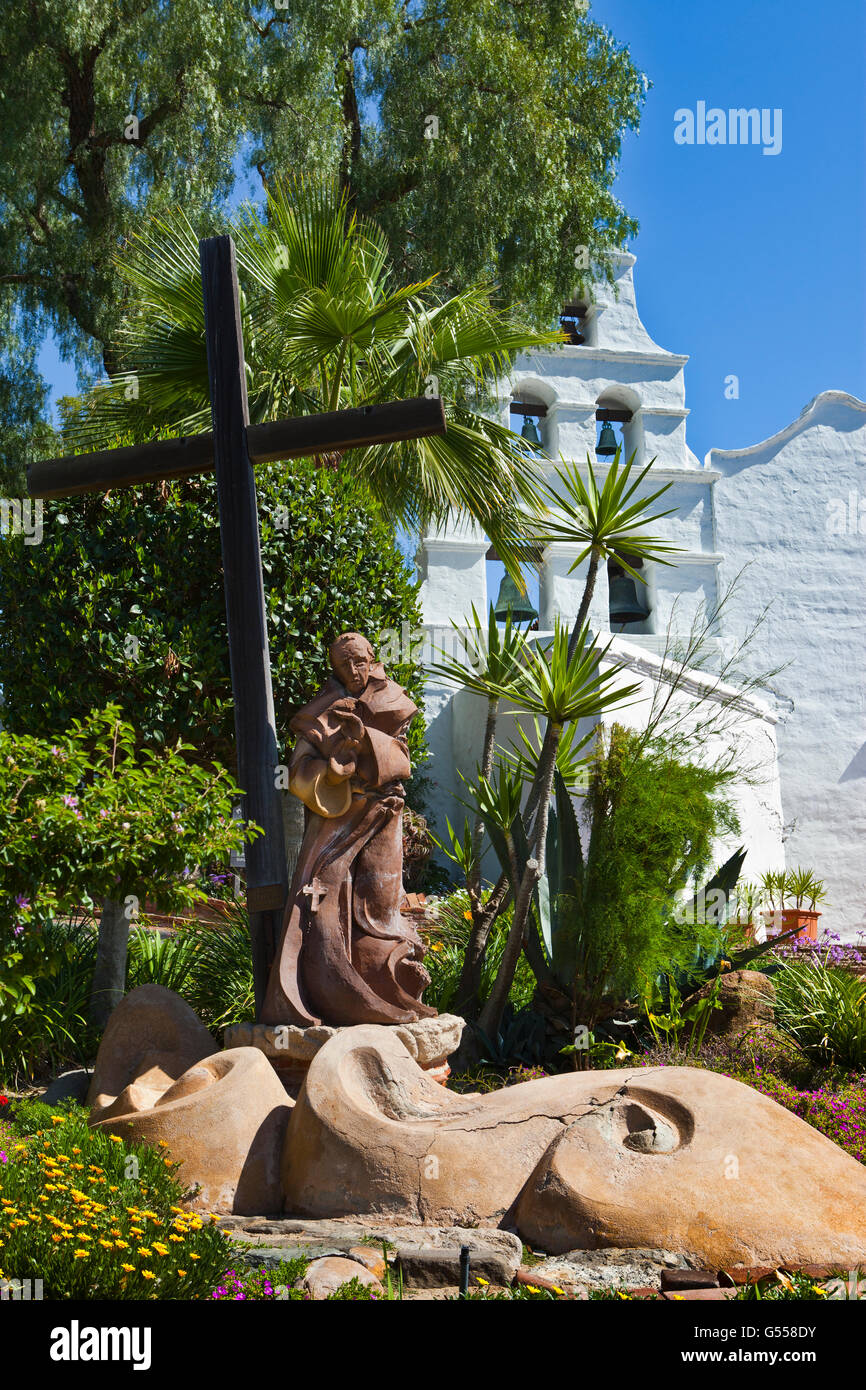 Statue of Father Junipero Serra, cross, and bell tower, Mission San Diego de Alcala, San Diego, CA, USA Stock Photo