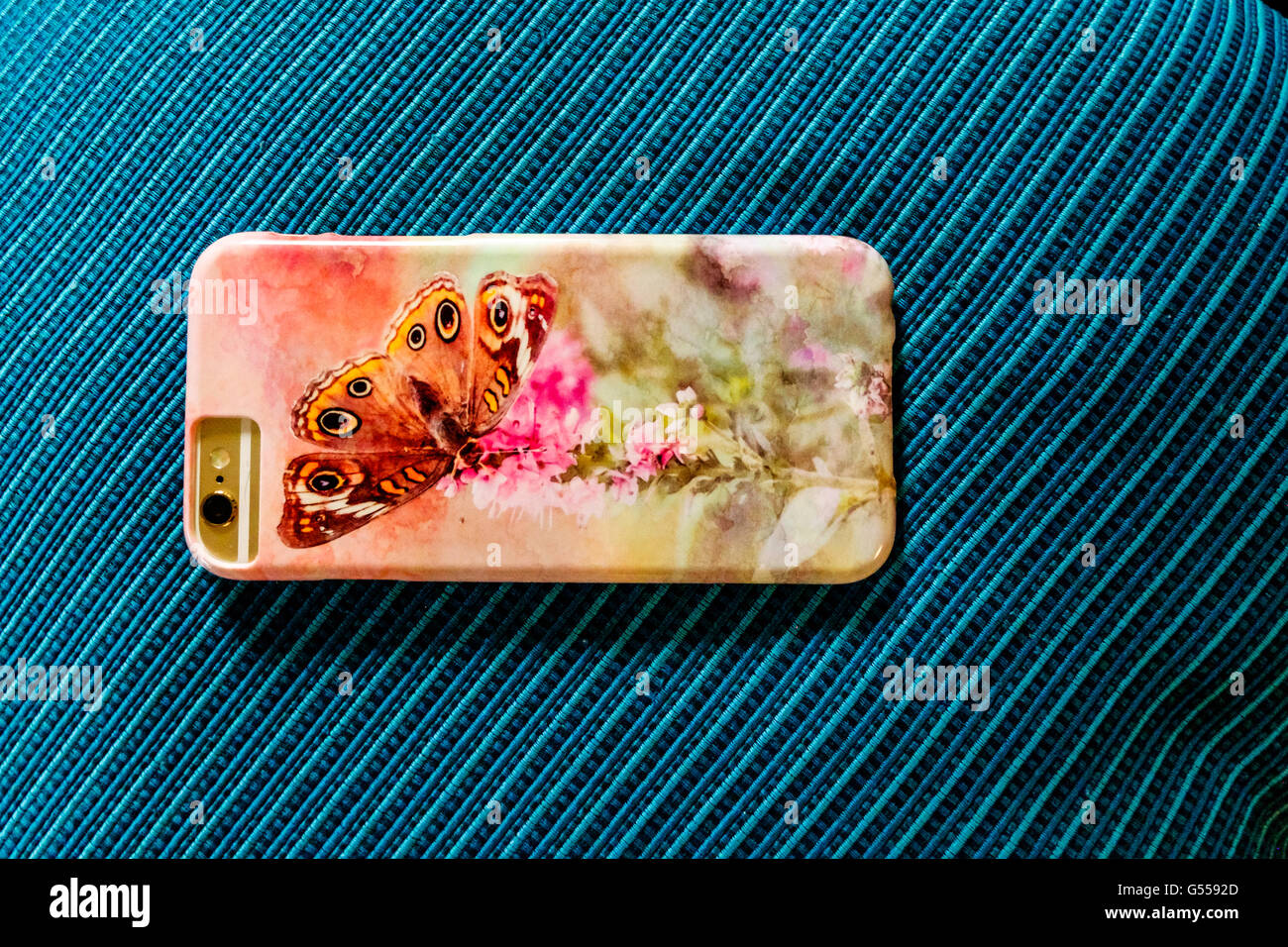 A personalized phone case for the iPhone 6s. Turquoise background, USA. Stock Photo