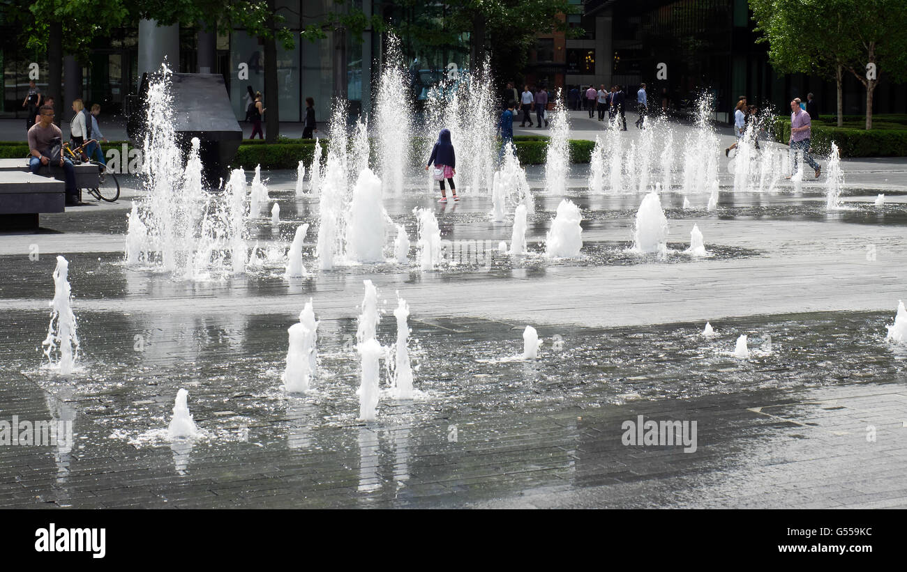 Person Standing in the Middle of a Fountain in London Stock Photo