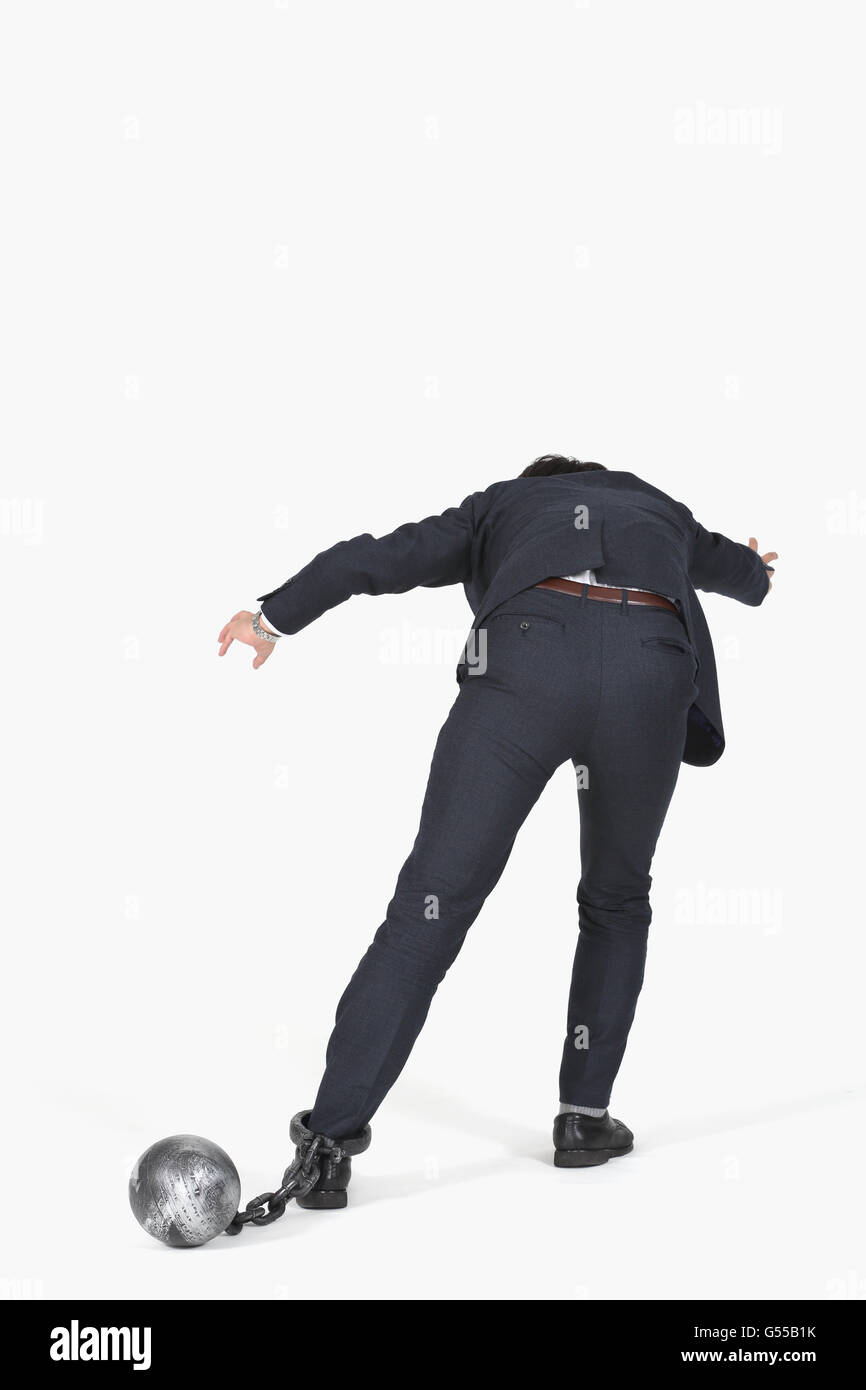 Japanese businessman with ball and chain Stock Photo Alamy