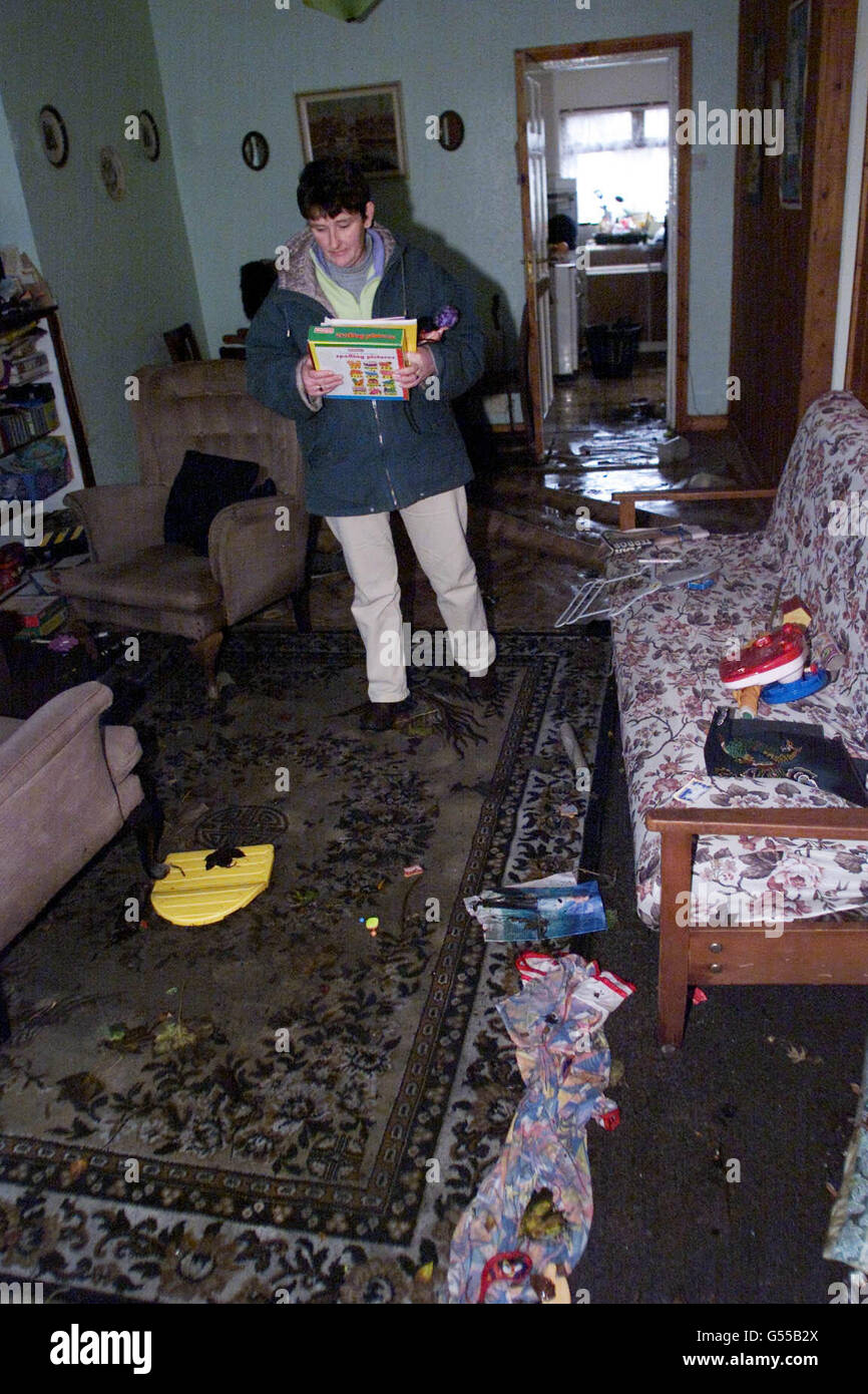 Local resident Dunne starts to clean up the mess after her home in Arklow, Co. Wicklow was