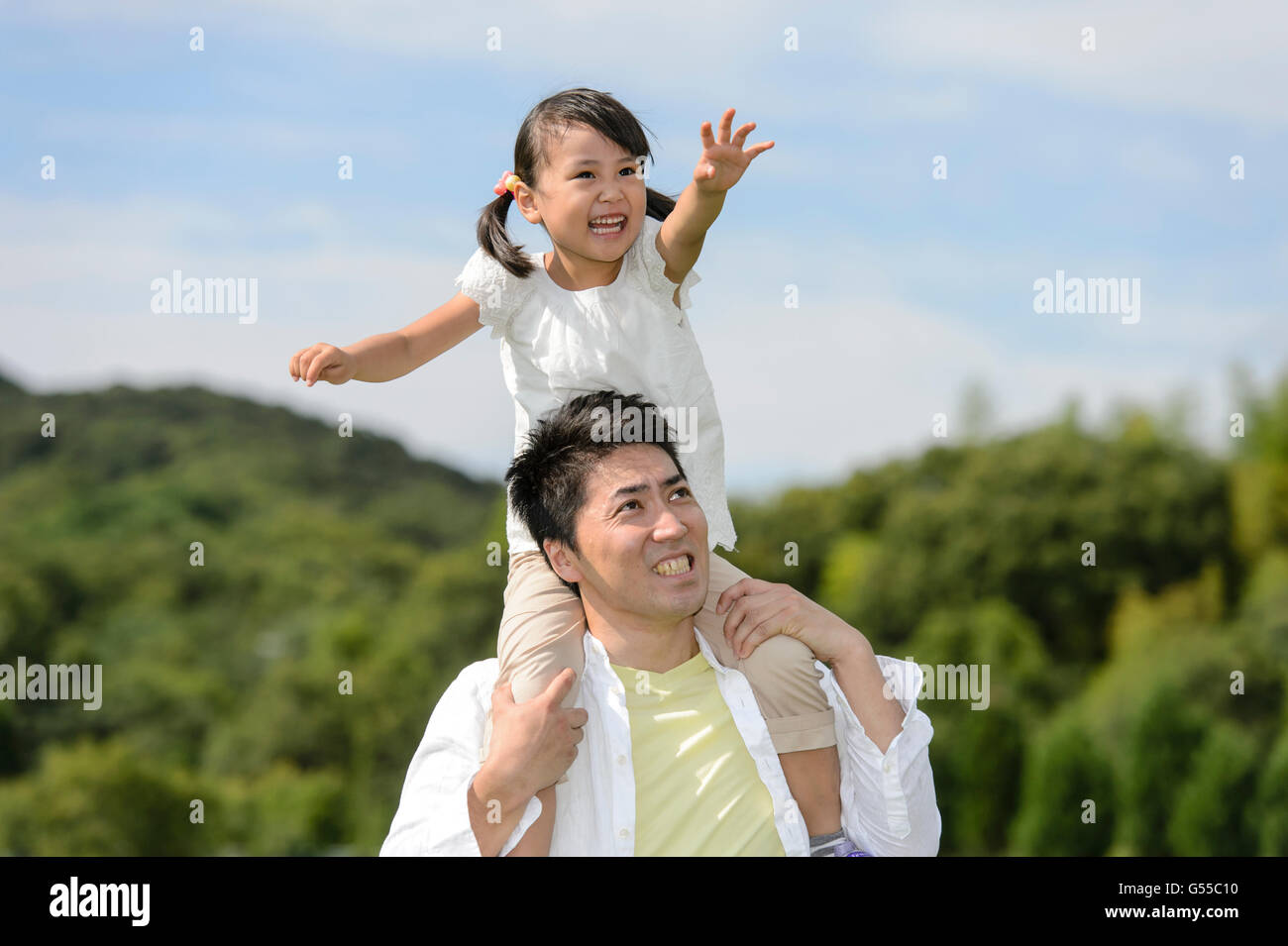 Kid with dad at the park Stock Photo