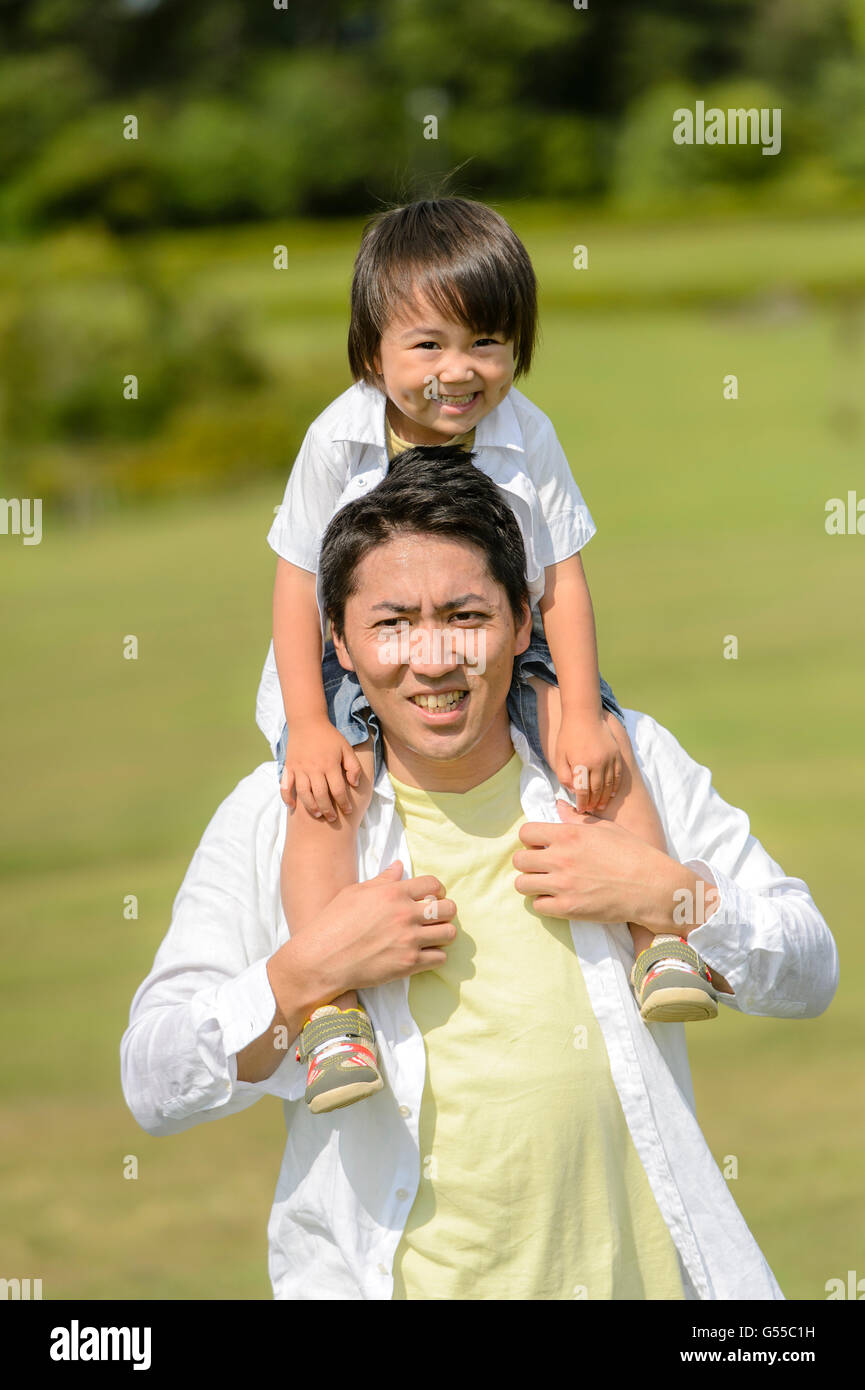 Kid with dad at the park Stock Photo