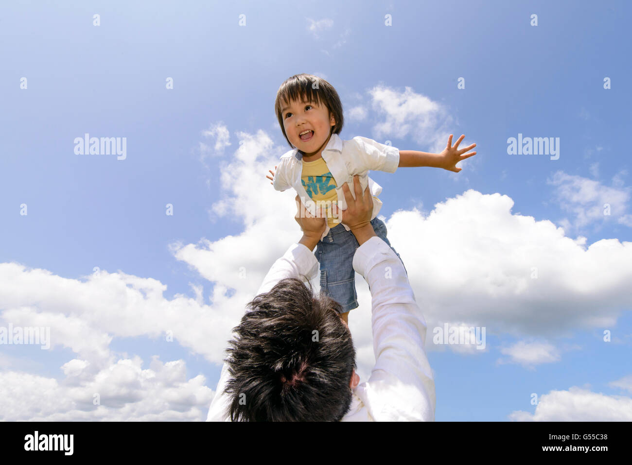 Kid with dad at the park Stock Photo