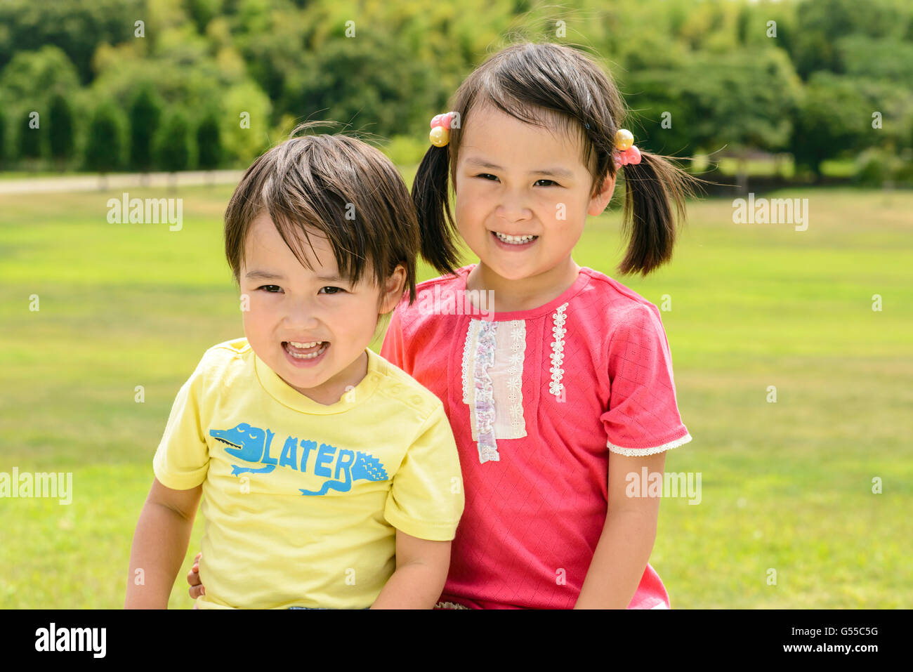 Kids playing in a park Stock Photo