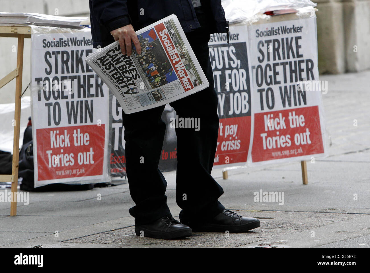 A demonstrator protests in Liverpool, as public sector workers go on strike in a row over pensions. Stock Photo
