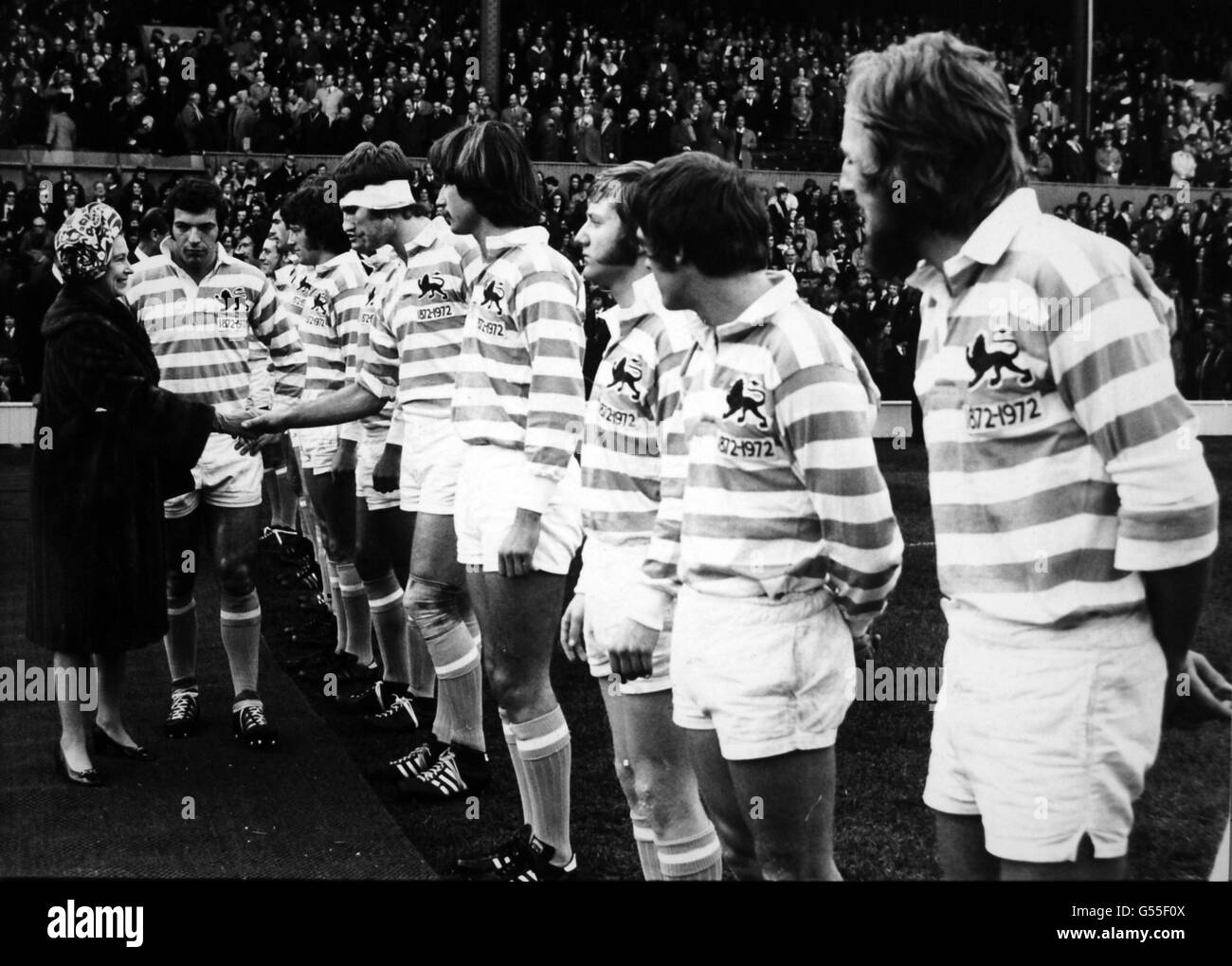 Scanned low-res from print, high-res available on request* Cambridge team captain, J.M Howard presenting his team to Queen Elizabeth II before the match. Stock Photo