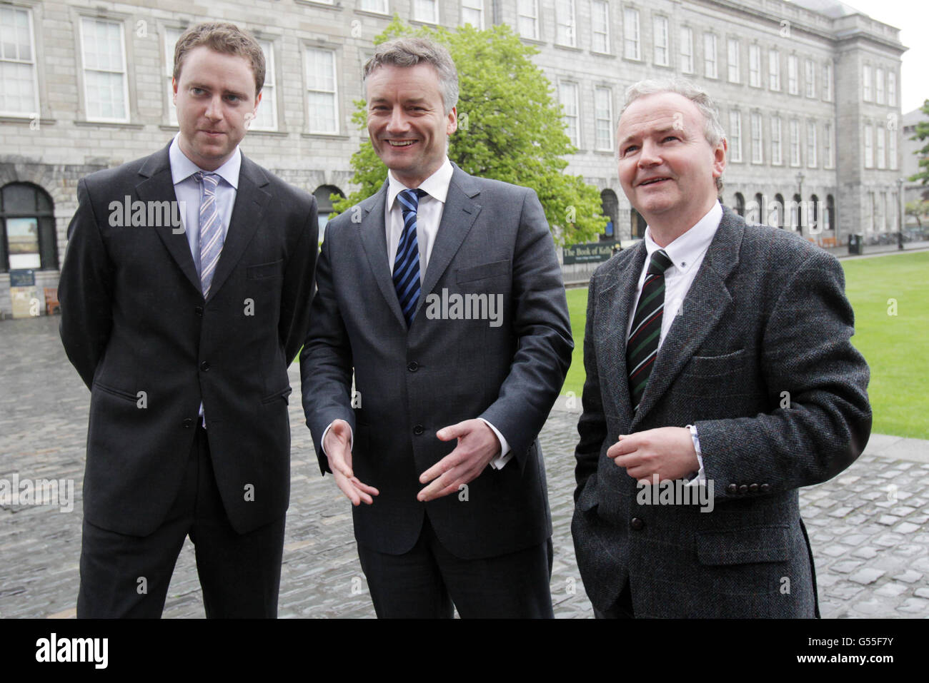 Provost Dr Patrick Prendergast (center) with historians Dr Peter Crooks (left) and Sean Duffy (right) in the grounds of Trinity College Dublin, as they launch the reconstruction of Irish Medieval documents burnt in the Four Courts during the Battle of Dublin in 1922. Stock Photo