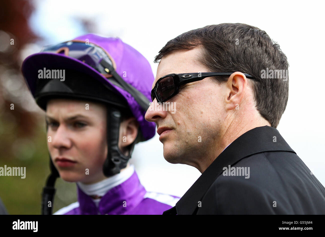 Aidan O'Brien, trainer watches his jockey Joseph O'Brien in the parade ring before the start of The Tattersalls Musidora Stakes Stock Photo