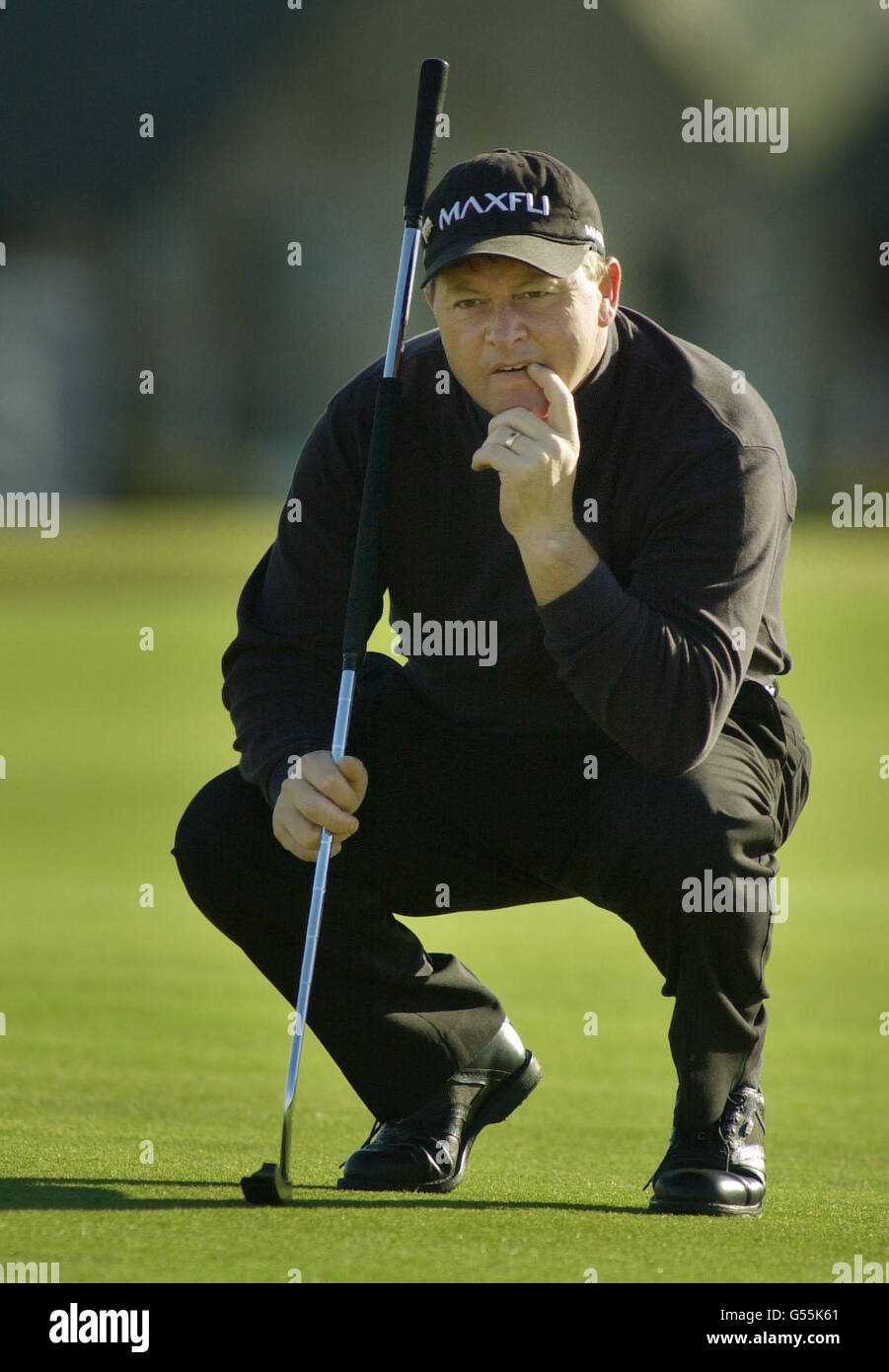 Wales’ Ian Woosnam pauses to line up his putt on the 16th green before