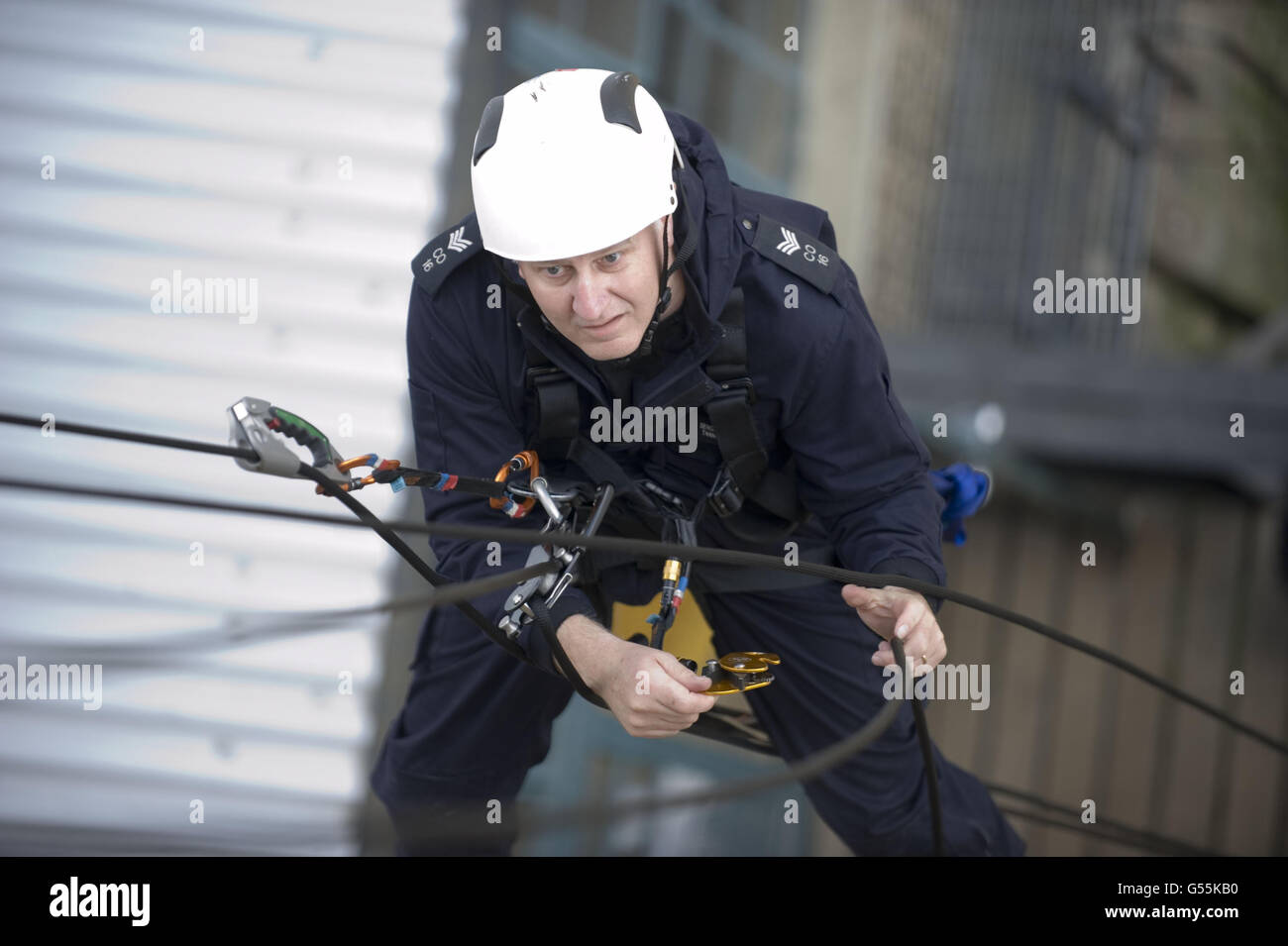 Metropolitan Police officers practise abseiling techniques at their River Thames base in Wapping. Stock Photo