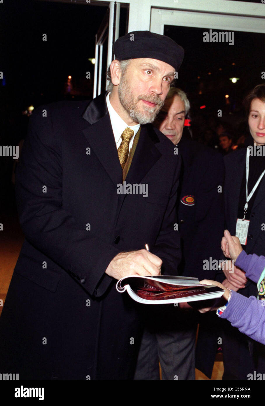 Actor John Malkovich, one of the stars of 'Shadow of the Vampire', signs autographs upon arrival for the film's premiere, which is part of the London Film Festival, at the Odeon West End cinema. Stock Photo