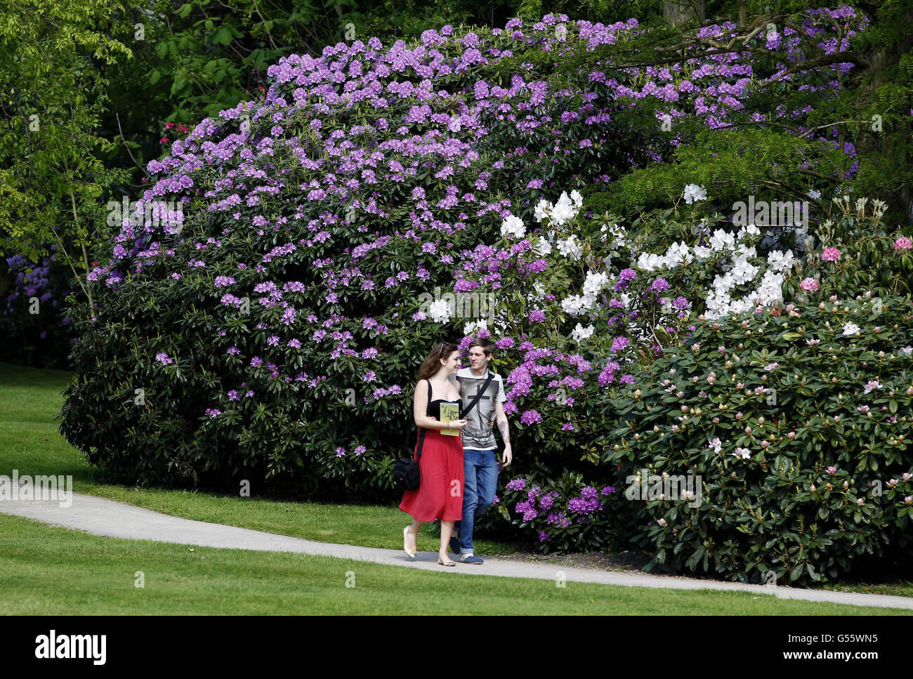 People walk in the grounds of Dunham Massey in Altrincham, Cheshire, as