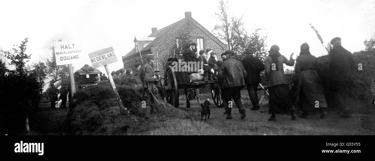 Belgians passing the boundary post between Belgium and Holland on their way back to the liberated portion of Belgium. Stock Photo