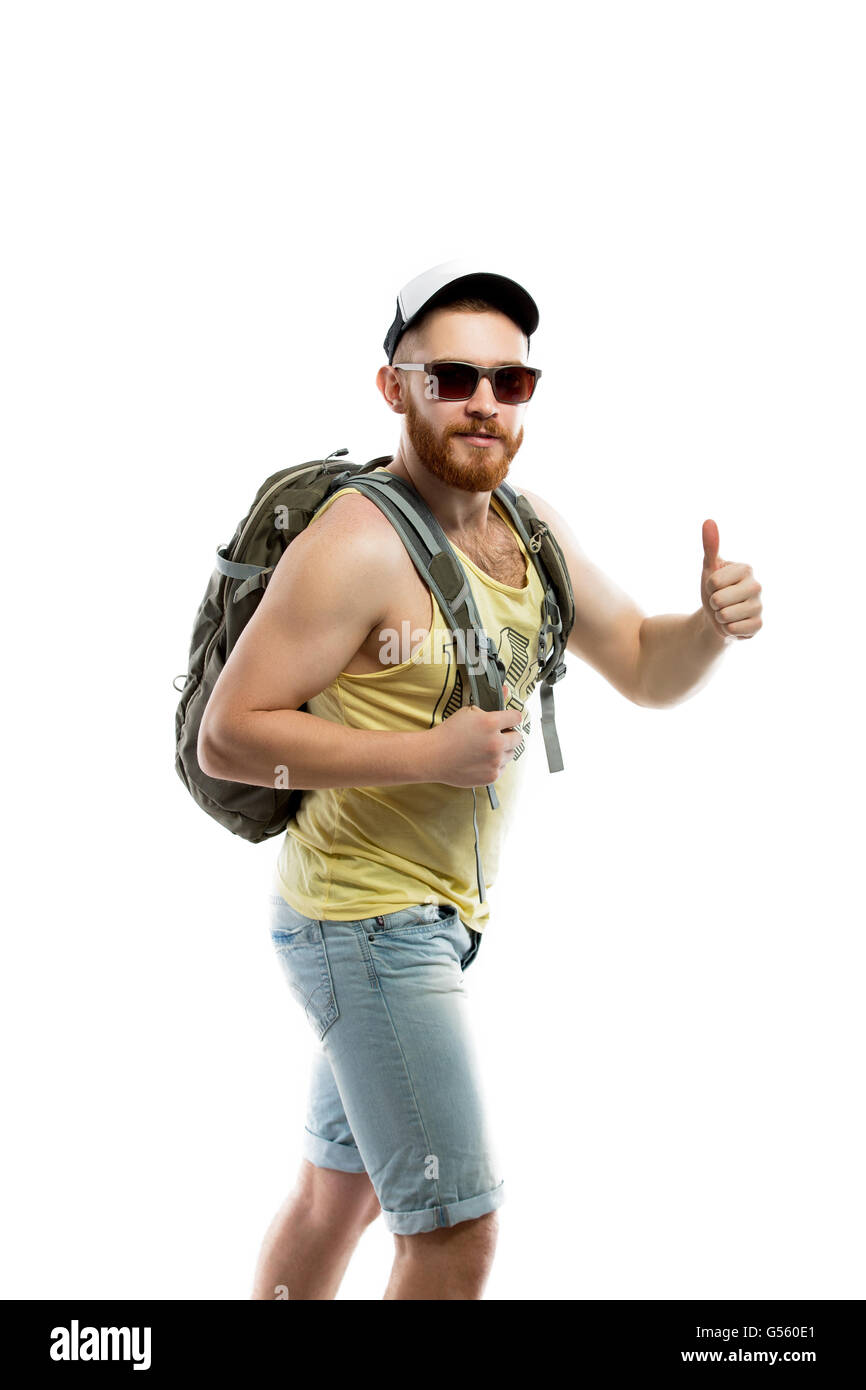 Side view of bearded traveler in sunglasses with backpack Stock Photo