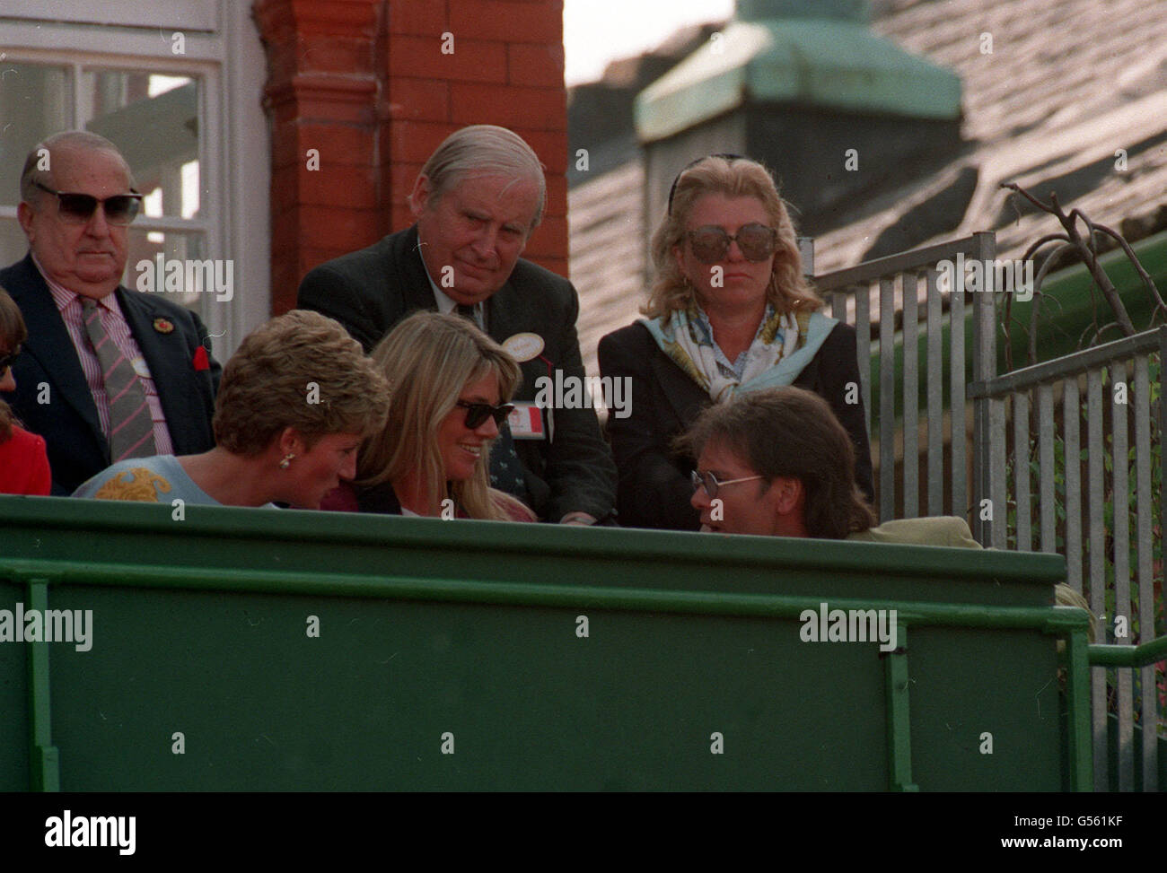 1993: The Princess of Wales (left) chats to pop singer Cliff Richard during the Stelle Artois Championships at Queen's Club. With them is a friend of the Princess, Kate Menzies. Stock Photo