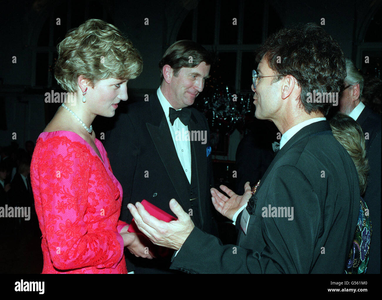 1991 : The Princess of Wales meets pop star Cliff Richard at London's Royal School of Music after she had attended the annual 'Joy to the World' Christmas spectacular at the nearby Royal Albert Hall. Stock Photo