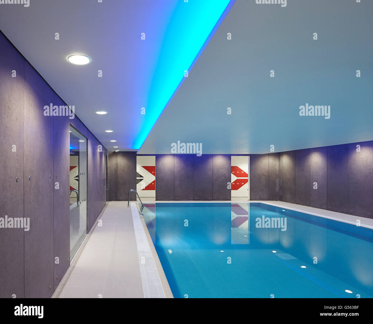 Indoor pool with inserted mood lighting. Spring Mews, London, United Kingdom. Architect: The Manser Practice, 2015. Stock Photo