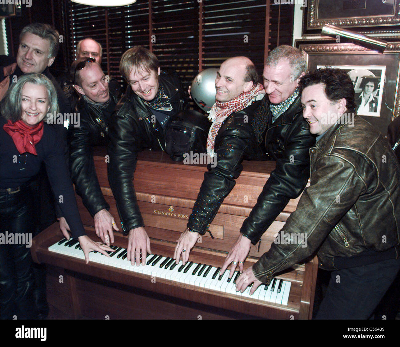 A group of bikers with the piano on which John Lennon wrote Imagine after it arrived at the Hard Rock Cafe in London. Collectors from across the world are due to bid for the piece of memorabilia associated with one of pop's most famous songs. * The Steinway Model Z upright piano was transported from Liverpool yesterday and is expected to fetch more than 1 million at the auction. See PA story SALE Lennon. PA photo: Peter J Jordan. Stock Photo