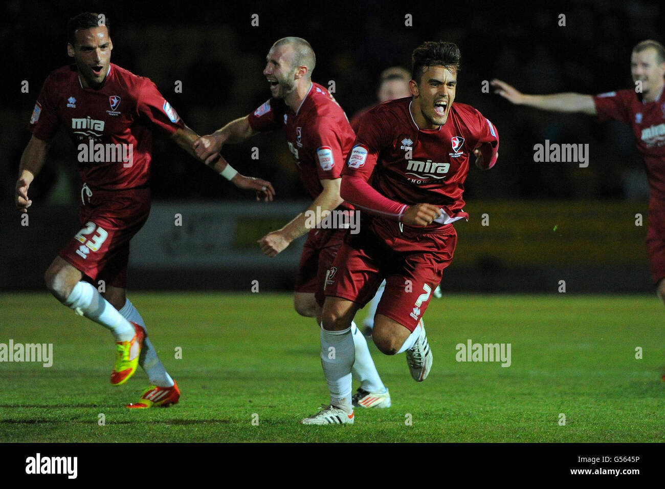 Cheltenham Town's Marlon Pack (7) with celebrates team mates after scoring his sides second goal of the game during the npower Football League Two Play Off Semi Final Second Leg match at Plainmoor, Torquay. Stock Photo