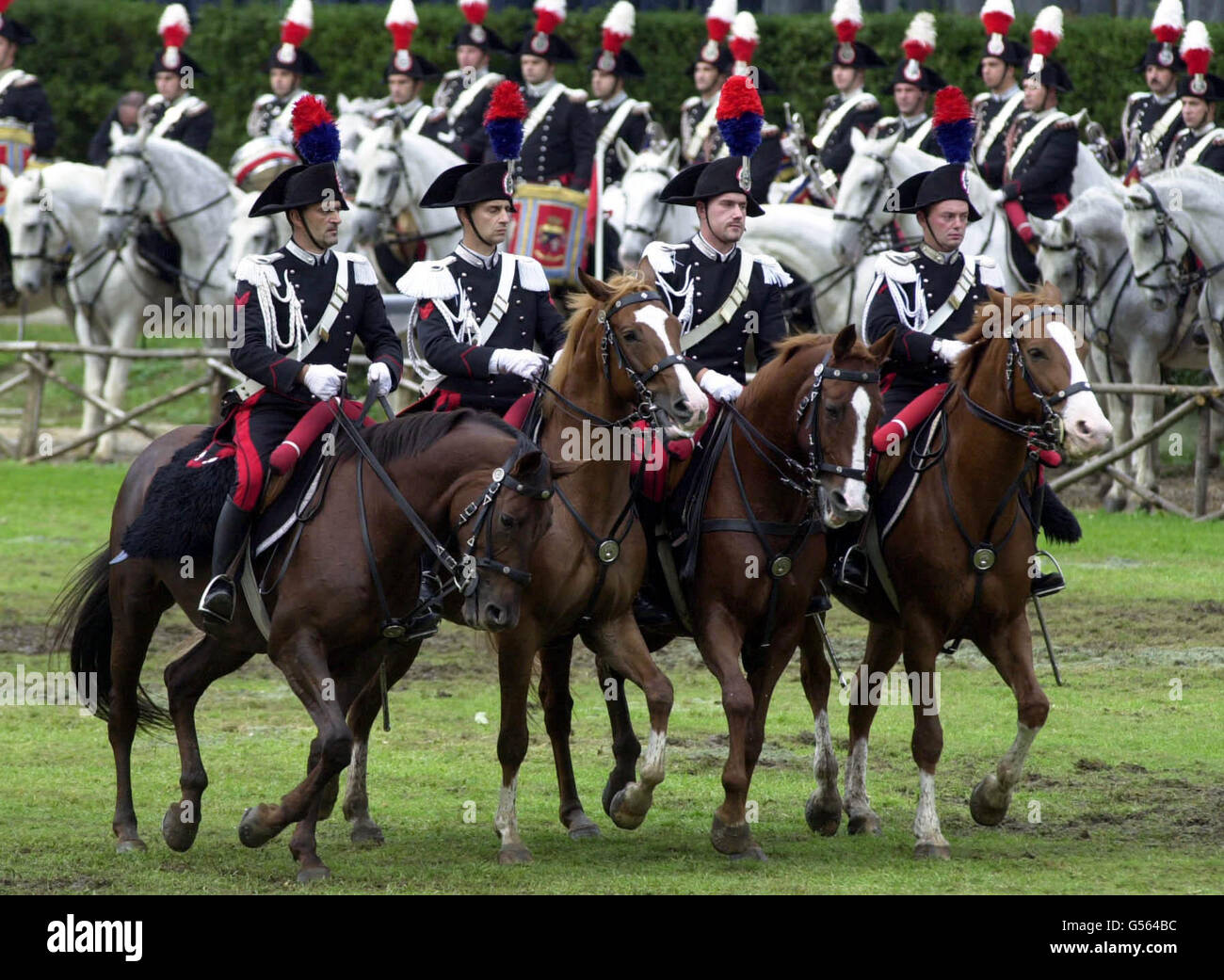 Carabinieri perform a mounted display for the British Queen Elizabeth II at the Piazza di Siena in Rome, on the second day of the state visit to Italy. Stock Photo