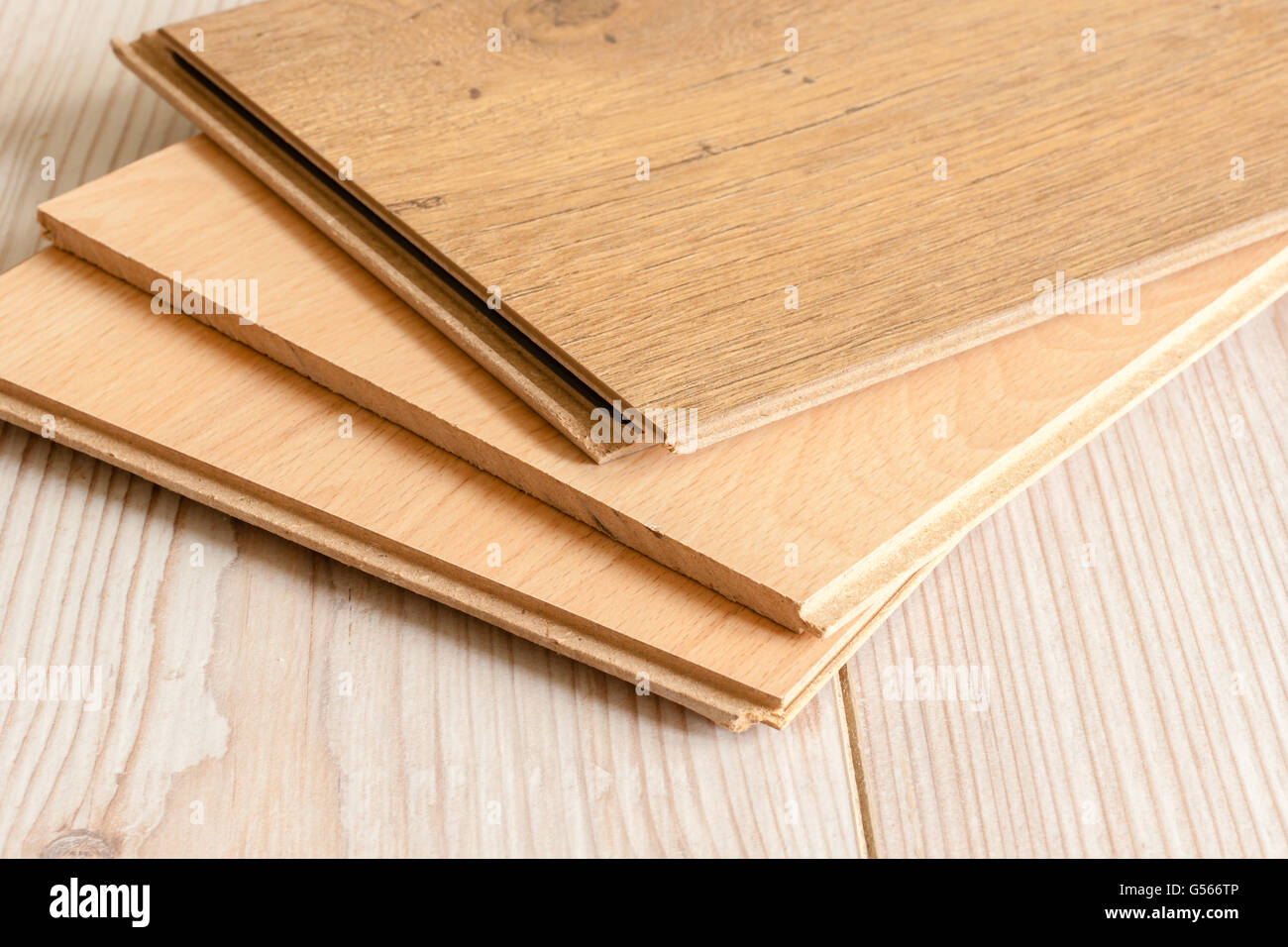 Pieces of wood laminate flooring ready to be laid Stock Photo