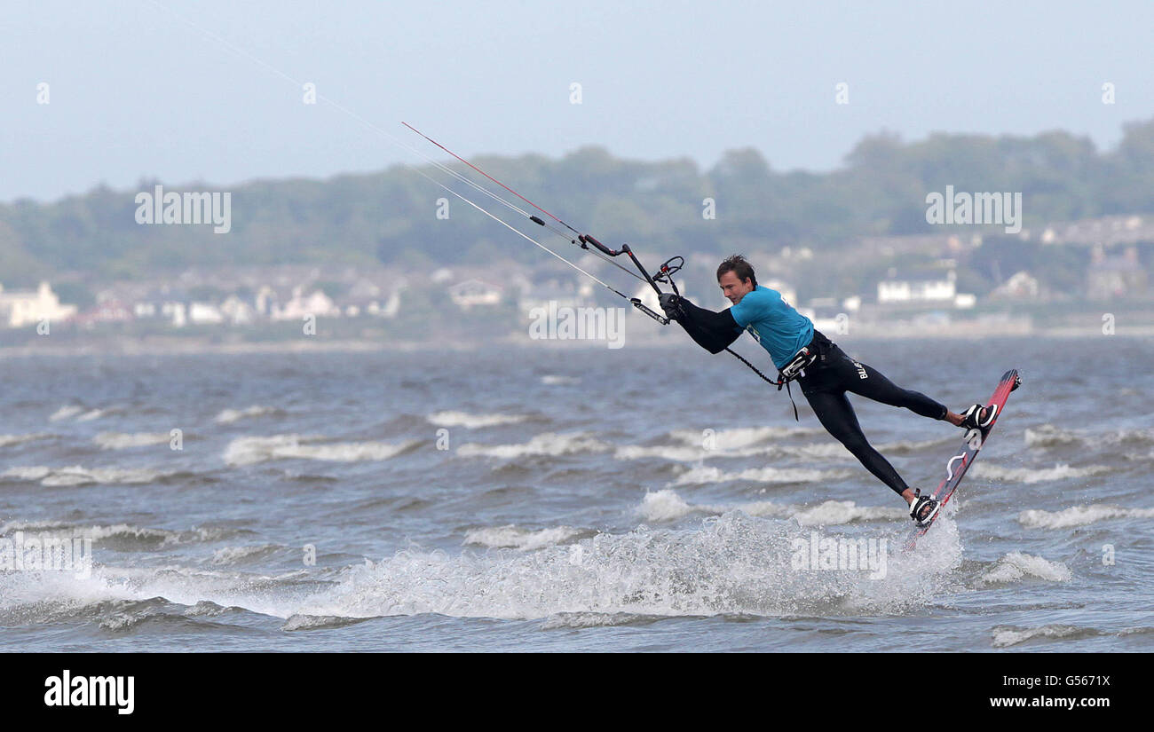 A kite surfer takes to the waves on Dublins Dollymount Strand in Dublin