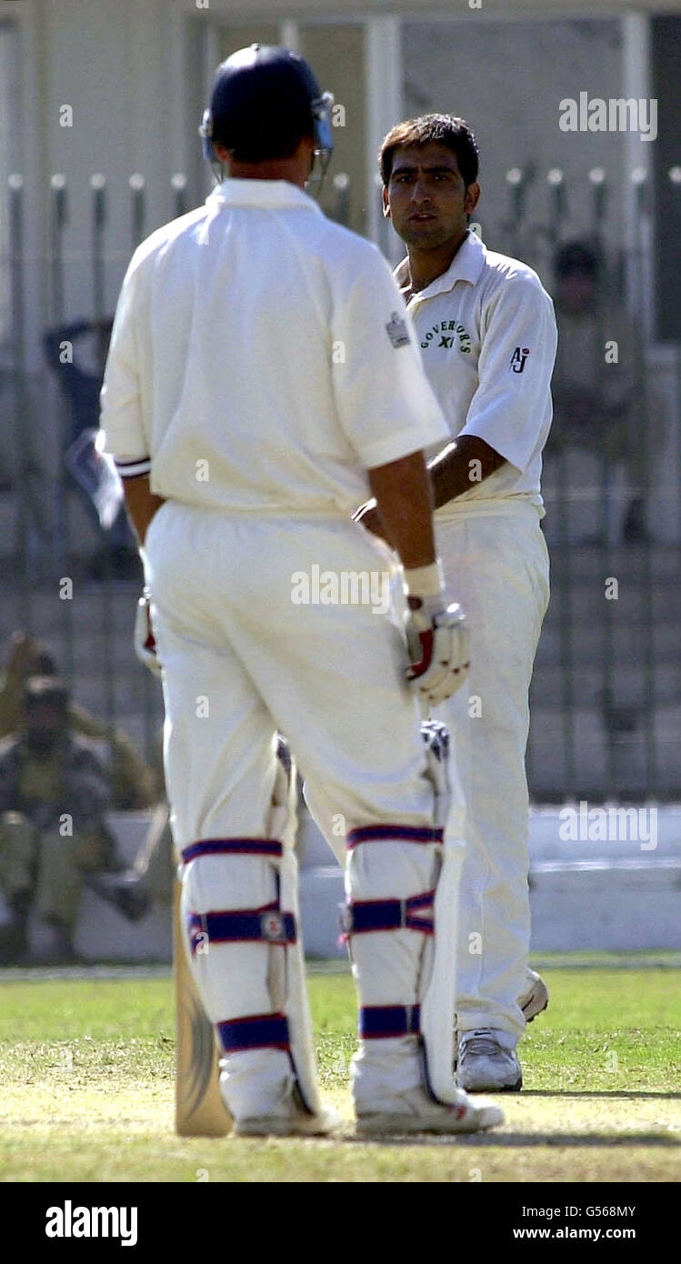 Governor's XI's Sajid Shah (right) and England skipper Nasser Hussain exchange glances during the final day of their friendly match against Governor's XI at Peshawar. Stock Photo