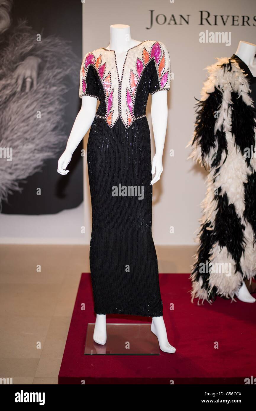 New York, NY, USA. 19th June, 2016. A BLACK, CREAM AND PINK BEADED EVENING GOWN With v-neck and short sleeves decorated with alternating pink sequined embellishments against a white beaded background, the bodice and long skirt with black beading, slit to reverse, with Bob Mackie label inside for Collection of Joan Rivers Press Preview, Christie's Auction House, New York, NY June 19, 2016. Credit:  Steven Ferdman/Everett Collection/Alamy Live News Stock Photo