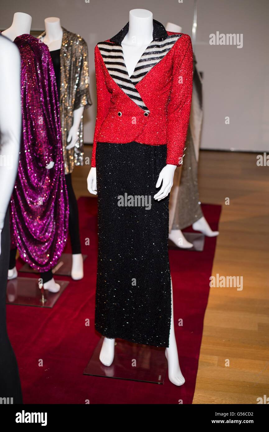 New York, NY, USA. 19th June, 2016. A BLACK, WHITE AND RED BEADED EVENING GOWN Simulating a two-piece suit with red jacket and black and silver beaded collar, overlaying a continuous long beaded black skirt with side slit, with Bob Mackie label inside for Collection of Joan Rivers Press Preview, Christie's Auction House, New York, NY June 19, 2016. Credit:  Steven Ferdman/Everett Collection/Alamy Live News Stock Photo