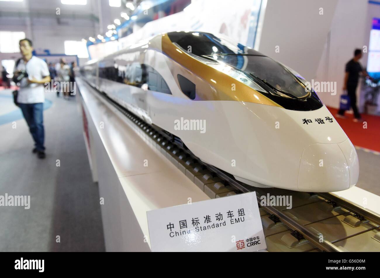 Beijing, China. 20th June, 2016. A visitor views a model of China standard EMU at the exhibition 'Modern Railways 2016' in Beijing, capital of China, June 20, 2016. The three-day exhibition kicked off here Monday. Credit:  Chen Yehua/Xinhua/Alamy Live News Stock Photo