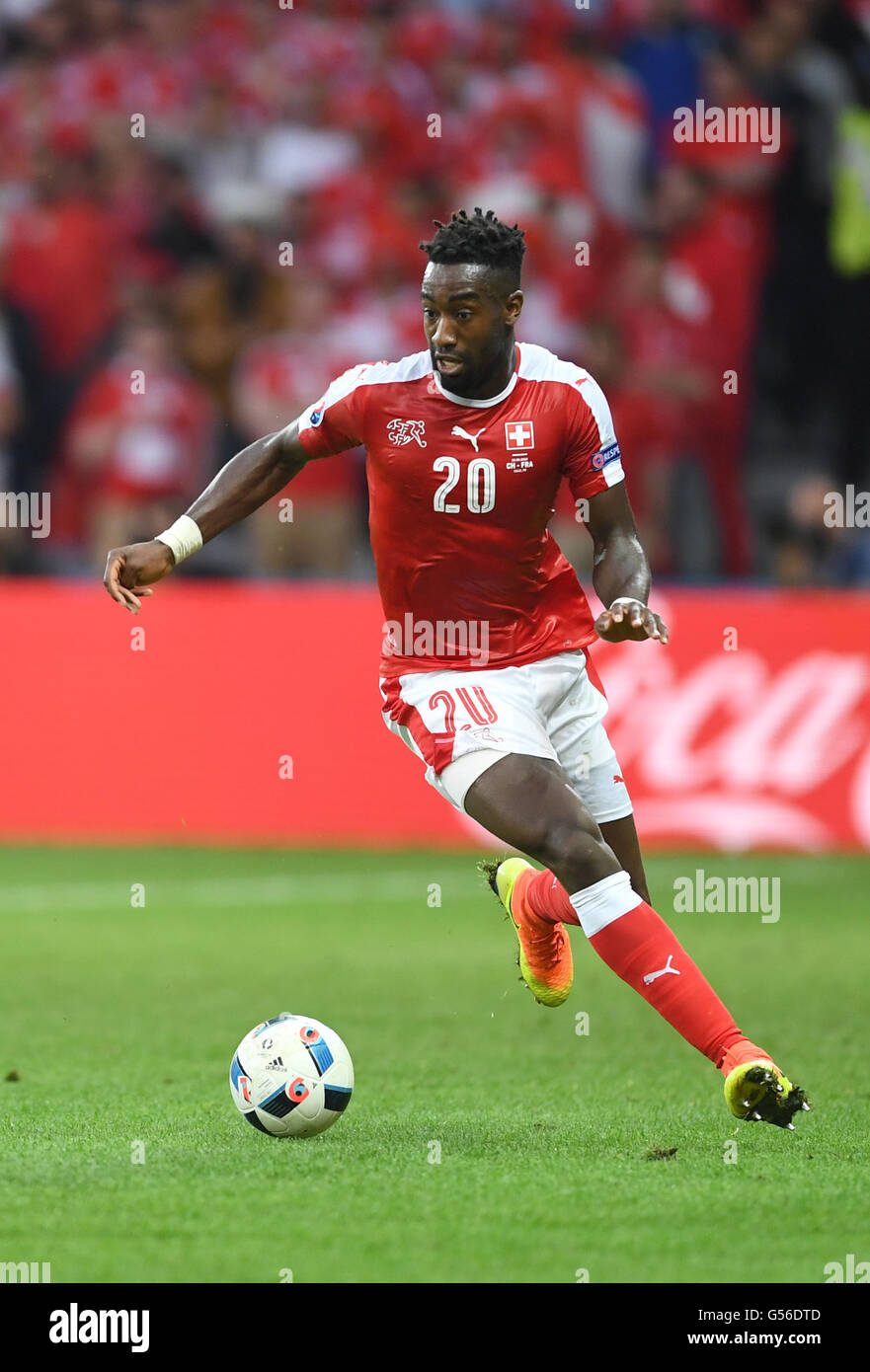 Lille, France. 19th June, 2016. Johan Djourou of Switzerland runs with the ball during the preliminary round match between Switzerland and France at Pierre Mauroy stadium in Lille, France, 19 June, 2016. Photo: Marius Becker/dpa/Alamy Live News Stock Photo