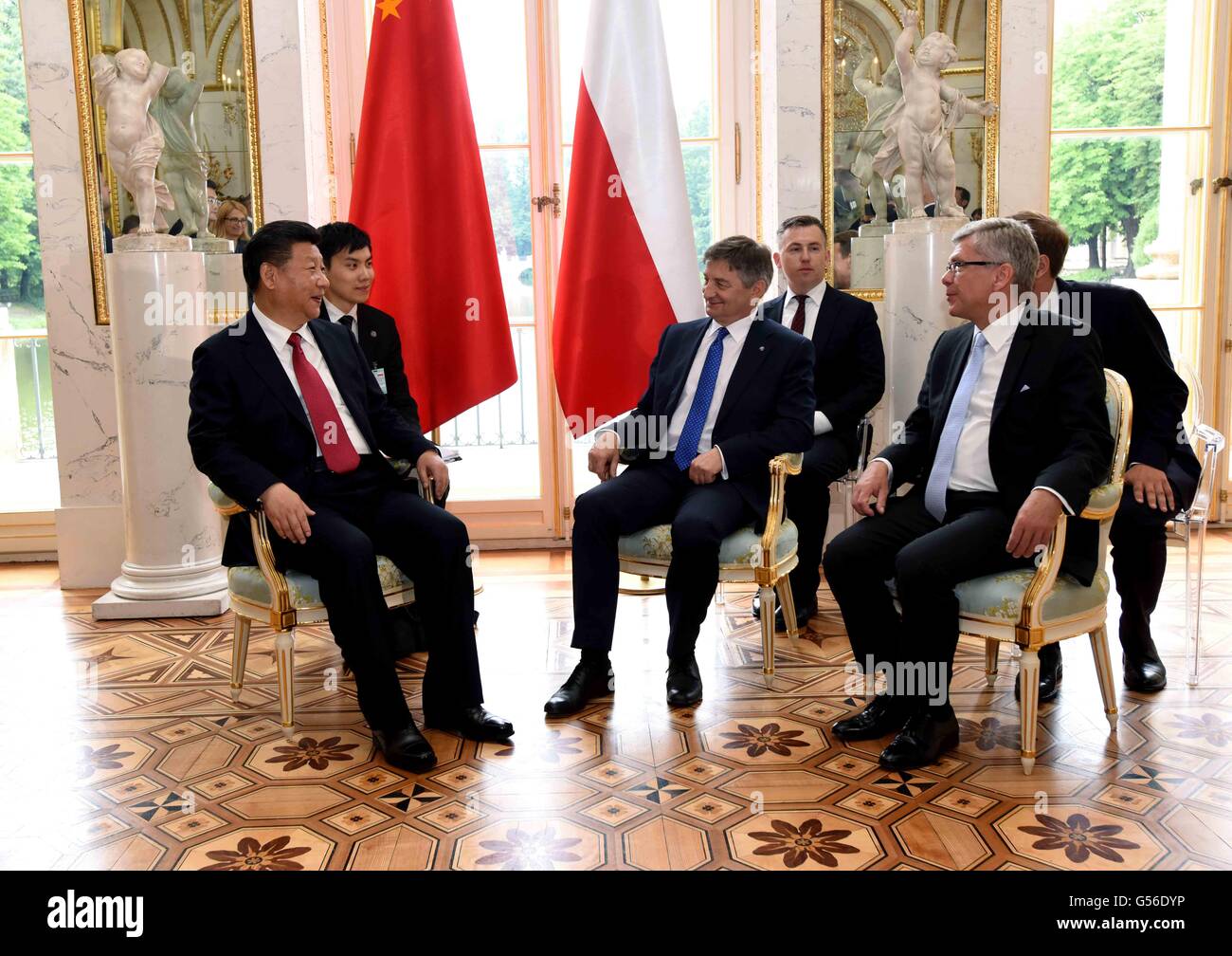 Warsaw, Poland. 20th June, 2016. Chinese President Xi Jinping (L front) meets with Marek Kuchcinski (C front), marshal of the lower chamber of the Polish parliament (Sejm), and Marshal of Senate Stanislaw Karczewski (R front) in Warsaw, Poland, June 20, 2016. © Rao Aimin/Xinhua/Alamy Live News Stock Photo