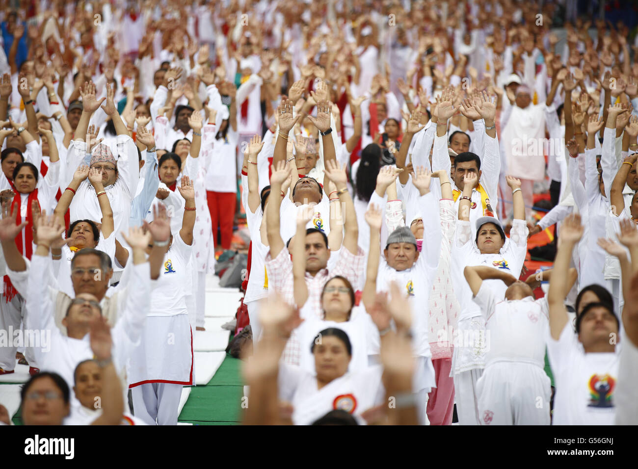 Kathmandu, Nepal. 21st June, 2016. Nepalese people perform Yoga on the occasion of International Yoga Day also known as Yog Diwas in Durbar Marg, Kathmandu, Nepal on Tuesday, June 21, 16. Thousands of people participated in the street to focus on the Yog day program. Credit:  Skanda Gautam/ZUMA Wire/Alamy Live News Stock Photo